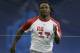 Running back Chris Johnson, of East Carolina, runs the 40-yard dash at the NFL Combine in Indianapolis, Sunday, Feb. 24, 2008. (AP Photo/Michael Conroy)