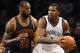 Brooklyn Nets forward Joe Johnson (7) looks to pass the ball around Cleveland Cavaliers forward LeBron James (23) in the first half of an NBA basketball game on Friday, March 27, 2015, in New York. (AP Photo/Kathy Kmonicek)