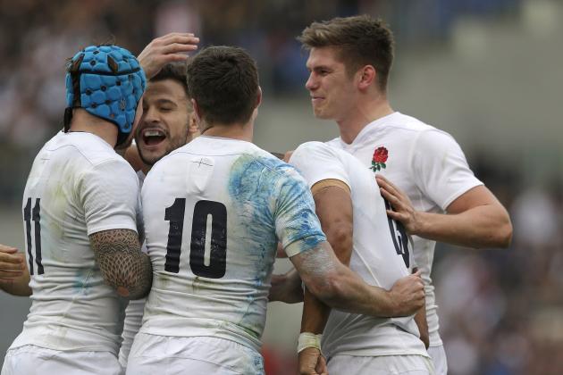 England’s Jonathan Joseph, second right, is greeted by teammates after scoring his second try during the Six Nations rugby union match between Italy and England, in Rome's Olympic stadium, Sunday, Feb. 14, 2016. (AP Photo/Andrew Medichini)