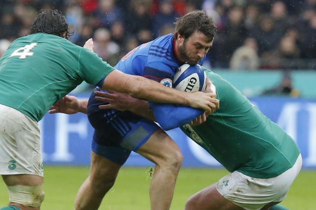 France's Maxime Medard, center, is tackled by Ireland's Mike McCarthy, left, and Ireland's Nathan Whiteduring a Six Nations tournament Rugby match, France against Ireland at Stade de France stadium in Saint-Denis, north of Paris, Saturday Feb. 13, 2016. France won 10-9. (AP Photo/Michel Euler)