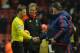 Manchester United's Welsh assistant manager Ryan Giggs (R obscured) shakes hands with referee Mark Clattenburg (L) as Manchester United's Dutch manager Louis van Gaal (R) and Liverpool's German manager Jurgen Klopp (2L) look on after the English Premier League football match between Liverpool and Manchester United at Anfield in Liverpool, northwest England, on January 17, 2016. Wayne Rooney scored the winning goal in Manchester United's 1-0 victory over Liverpool. AFP PHOTO / PAUL ELLIS
RESTRICTED TO EDITORIAL USE. No use with unauthorized audio, video, data, fixture lists, club/league logos or 'live' services. Online in-match use limited to 75 images, no video emulation. No use in betting, games or single club/league/player publications. / AFP / PAUL ELLIS (Photo credit should read PAUL ELLIS/AFP/Getty Images)