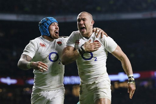 England's Mike Brown, right, celebrates with Jack Nowell after scoring his side's second try during the Six Nations international rugby match between England and Ireland at Twickenham stadium in London, Saturday, Feb. 27, 2016. (AP Photo/Kirsty Wigglesworth)