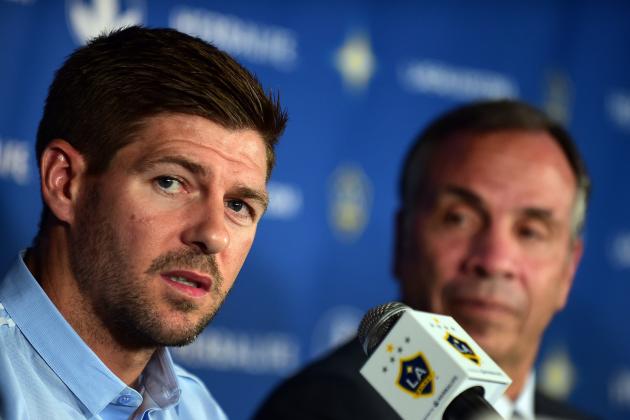 Former Liverpool and England International soccer star Steven Gerrard responds to questions while seated beside coach Bruce Arena during a press conference following a training session with Gerrard's new teammates from Major League Soccer's LA Galaxy in Carson, California, on July 7, 2015. AFP PHOTO / FREDERIC J. BROWN        (Photo credit should read FREDERIC J. BROWN/AFP/Getty Images)