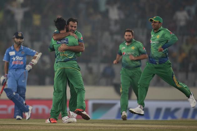 Pakistan’s Mohammad Amir, back to camera, celebrates with his teammates after the dismissal of India’s Rohit Sharma, unseen,during the Asia Cup Twenty20 international cricket match between them in Dhaka, Bangladesh, Saturday, Feb. 27, 2016. (AP Photo/A.M. Ahad)