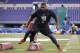 Louisville defensive lineman Sheldon Rankins runs a drill at the NFL football scouting combine in Indianapolis, Sunday, Feb. 28, 2016. (AP Photo/Michael Conroy)