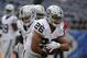 Oakland Raiders running back Roy Helu (26) takes a handoff during warmups before an NFL football game against the San Diego Chargers Sunday, Oct. 25, 2015, in San Diego. (AP Photo/Lenny Ignelzi)