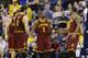 Cleveland Cavaliers guard Kyrie Irving (2) celebrates with forward Kevin Love (0) and guard J.R. Smith (5) during the second half of an NBA basketball game against the Indiana Pacers in Indianapolis, Monday, Feb. 1, 2016. The Cavaliers defeated the Pacers 111-106 in overtime. (AP Photo/Michael Conroy)