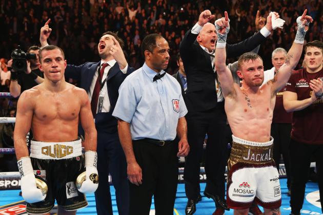 MANCHESTER, ENGLAND - FEBRUARY 27:  Carl Frampton (2R) celebrates a points victory over Scott Quigg (L) as his manager Barry McGuigan (4L) reacts after their World Super-Bantamweight title contest at Manchester Arena on February 27, 2016 in Manchester, England. Frampton's victory united the WBA and IBF titles.  (Photo by Alex Livesey/Getty Images)