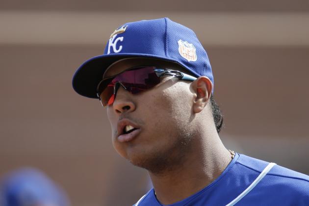 Kansas City Royals' Salvador Perez waits to participate in a drill during spring training baseball practice Tuesday, Feb. 23, 2016, in Surprise, Ariz. (AP Photo/Charlie Riedel)