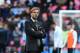 Liverpool's German manager Jurgen Klopp walks on the pitch as his players warm up ahead of the League Cup final football match between Liverpool and Manchester City at Wembley Stadium in London on February 28, 2016. / AFP / Ben STANSALL / RESTRICTED TO EDITORIAL USE. No use with unauthorized audio, video, data, fixture lists, club/league logos or 'live' services. Online in-match use limited to 75 images, no video emulation. No use in betting, games or single club/league/player publications. / (Photo credit should read BEN STANSALL/AFP/Getty Images)
