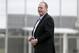 FILE- In this Feb. 25, 2015, file photo, baseball broadcast analyst and former Boston Red Sox pitcher Curt Schilling watches as the Red Sox workout at baseball spring training in Fort Myers Fla. Boston Mayor Martin J. Walsh wants to ban chewing tobacco in sports venues across the city. The mayor is expected to discuss a proposed new ordinance Wednesday, Aug. 5. Public health officials, advocates, local youth and Schilling are expected to attend. (AP Photo/Tony Gutierrez, File)