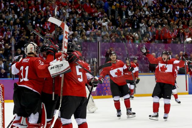 Team Canada celebrates its 3-0 win over Sweden in the men's gold medal ice hockey game at the 2014 Winter Olympics, Sunday, Feb. 23, 2014, in Sochi, Russia. (AP Photo/Julio Cortez)
