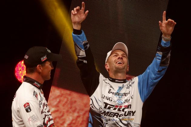 Angler Edwin Evers, Talala, Okla., watches as Randy Howell, Springville, Ala., reacts to learning that he has won the Bassmasters Classic at the weigh-in, Sunday, Feb. 23, 2014 in Birmingham, Ala. (AP Photo/Hal Yeager)