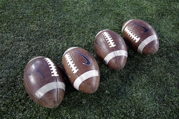 Footballs sit on the field before an NCAA college football game between Memphis and Houston Saturday, Nov. 14, 2015, in Houston. (AP Photo/David J. Phillip)