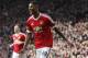 Manchester United's Marcus Rashford, runs to celebrate with teammates after scoring his sides second goal of the game during the English Premier League soccer match between Manchester United and Arsenal at Old Trafford Stadium, Manchester, England, Sunday, Feb. 28, 2016. (AP Photo/Jon Super)