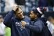 Houston Texans' Arian Foster, right, talks with New England Patriots' Tom Brady, left, before an NFL football game Sunday, Dec. 1, 2013, in Houston. (AP Photo/David J. Phillip)