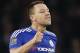 Chelsea's John Terry, gives a thumbs up as he talks to his teammate Chelsea goalkeeper Thibaut Courtois during the English Premier League soccer match between Arsenal and Chelsea at the Emirates stadium in London, Sunday, Jan. 24, 2016.(AP Photo/Frank Augstein)