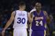 Los Angeles Lakers' Kobe Bryant, right, greets Golden State Warriors' Stephen Curry (30) prior to an NBA basketball game Thursday, Jan. 14, 2016, in Oakland, Calif. (AP Photo/Ben Margot)