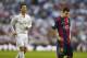 Real Madrid's Cristiano Ronaldo, left, runs as Barcelona's Lionel Messi, gestures during a Spanish La Liga soccer match between Real Madrid and FC Barcelona at the Santiago Bernabeu stadium in Madrid, Spain, Saturday, Oct. 25, 2014. (AP Photo/Andres Kudacki)