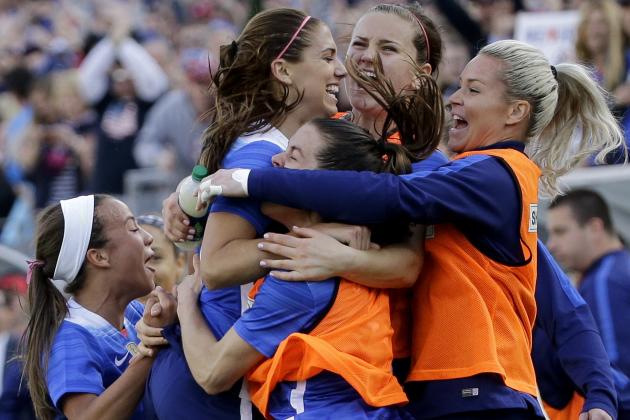 United States' forward Alex Morgan, top left, celebrates with teammates after she scored the game-winning goal against France during the second half of a SheBelieves Cup women's soccer match Sunday, March 6, 2016, in Nashville, Tenn. The United States won 1-0. (AP Photo/Mark Humphrey)