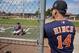 Houston Astros manager A.J. Hinch (14) watches catchers and pitchers during a spring training baseball workout, Friday, Feb. 19, 2016, in Kissimmee, Fla. (AP Photo/John Raoux)