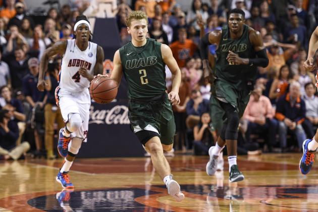 Nov 13, 2015; Auburn, AL, USA; UAB Blazers guard Nick Norton (2) dribbles as Auburn Tigers guard T.J. Dunans (4) trails during the second half at Auburn Arena. Auburn won 75-74. Mandatory Credit: Shanna Lockwood-USA TODAY Sports