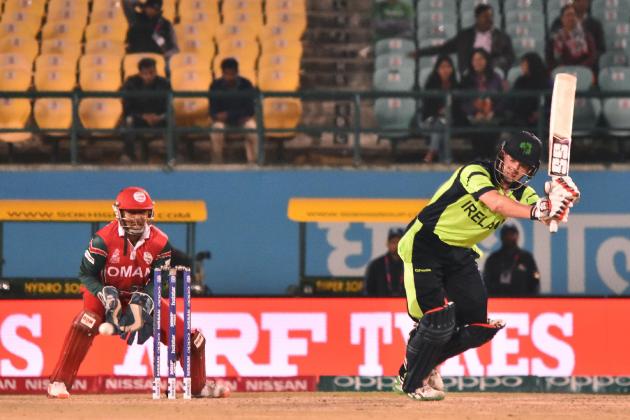 Ireland's William Porterfield(R)is watched by Oman's captain and wicketkeeper Sultan Ahmed as he plays a shot during the World T20 cricket tournament match between Ireland and Oman at The Himachal Pradesh Cricket Association Stadium in Dharamsala on March 9, 2016. / AFP / STRINGER (Photo credit should read STRINGER/AFP/Getty Images)