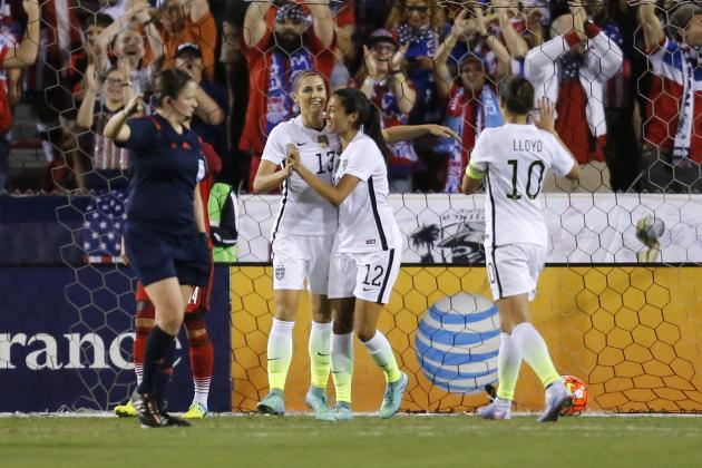 United States' Alex Morgan (13) is congratulated by Christen Press (12) after scoring a goal against Germany during the first half of a soccer game in the SheBelieves Cup, Wednesday, March 9, 2016,  in Boca Raton, Fla.  (AP Photo/Joel Auerbach)