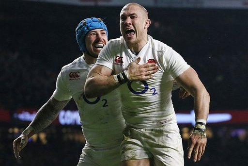 England's Mike Brown, right, celebrates with Jack Nowell after scoring his side's second try during the Six Nations international rugby match between England and Ireland at Twickenham stadium in London, Saturday, Feb. 27, 2016. (AP Photo/Kirsty Wigglesworth)