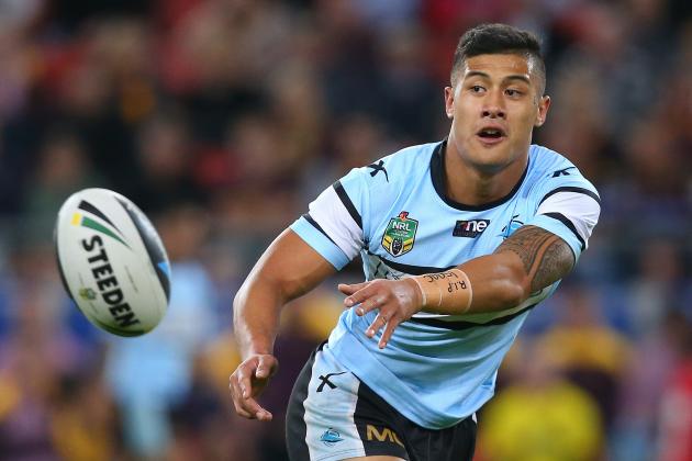 BRISBANE, AUSTRALIA - JUNE 27:  Fa'amanu Brown of the Sharks passes the ball during the round 16 NRL match between the Brisbane Broncos and the Cronulla Sharks at Suncorp Stadium on June 27, 2014 in Brisbane, Australia.  (Photo by Chris Hyde/Getty Images)