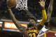 Cleveland Cavaliers forward LeBron James, left, drives to the basket against Sacramento Kings forward Quincy Acy, center, as Cavaliers center Tristan Thompson, right, looks on during the first quarter of an NBA basketball game Wednesday, March 9, 2016, in Sacramento, Calif. (AP Photo/Rich Pedroncelli)