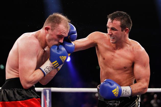 BERLIN, GERMANY - FEBRUARY 02:  Juergen Braehmer (L) of Germany and Eduard Gutknecht of Germany exchange punches during the WBO  European Championship Light Heavyweight title fight at Max-Schmeling Hall on February 2, 2013 in Berlin, Germany.  (Photo by Boris Streubel/Getty Images)