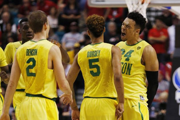 Oregon forward Dillon Brooks, right, reacts with guards Tyler Dorsey (5) and Casey Benson (2) during the second half of an NCAA college basketball game against Arizona in the semifinals of the Pac-12 men's tournament Friday, March 11, 2016, in Las Vegas. Oregon won in overtime, 95-89. (AP Photo/John Locher)