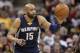 Memphis Grizzlies' Vince Carter (15) drives the ball downcourt in the first half of an NBA basketball game against the Cleveland Cavaliers, Monday, March 7, 2016, in Cleveland. (AP Photo/Tony Dejak)