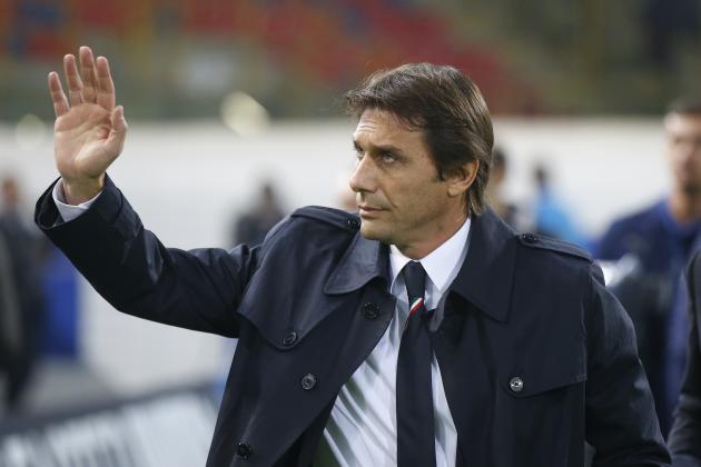Italy’s coach Antonio Conte waves to spectators prior to the start of a friendly soccer match between Italy and Romania at the Renato Dall'Ara stadium in Bologna, Italy, Tuesday, Nov. 17, 2015. (AP Photo/Luca Bruno)