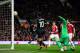 Liverpool’s Philippe Coutinho, center, scores his side’s first goal past United goalkeeper David De Gea during the Europa League round of 16, second leg, soccer match between Manchester United and Liverpool at Old Trafford Stadium in Manchester, England, Thursday March 17, 2016. (AP Photo/Jon Super)