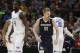 Gonzaga forward Domantas Sabonis, center, celebrates after scoring a basket as Seton Hall guard Ismael Sanogo, left, and forward Angel Delgado turn away during the second half of a first-round men's college basketball game Thursday, March 17, 2016, in the NCAA Tournament in Denver. Gonzaga won 68-52. (AP Photo/David Zalubowski)