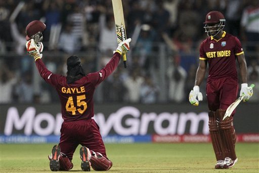 West Indies’ Chris Gayle raises his bat after scoring hundred runs against England during their ICC World Twenty20 2016 cricket match at the Wankhede stadium in Mumbai, India, Wednesday, March 16, 2016. (AP Photo/Rafiq Maqbool)