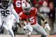Ohio State running back Ezekiel Elliott, right, gets past Minnesota defender Hendrick Ekpe during an NCAA college football game Saturday, Nov. 7, 2015, in Columbus, Ohio. Ohio State beat Minnesota 28-14. (AP Photo/Paul Vernon)