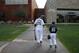 FILE - In this Feb. 28, 2015, file photo, Chicago White Sox's Adam LaRoche, left, and his son Drake walk to the White Sox's clubhouse during a photo day before a baseball spring training workout in Phoenix. Kudos to Adam LaRoche for wanting to spend time with his son, and walking away from a $13 million salary to make sure that happened. But there's nothing wrong with the White Sox telling the now-retired first baseman that