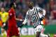 Juventus' Paul Pogba, right, celebrates after scoring the opening goal during the Champions League round of 16 second leg soccer match between FC Bayern Munich and Juventus Turin in Munich, southern Germany, Wednesday, March 16, 2016. (AP Photo/Matthias Schrader)