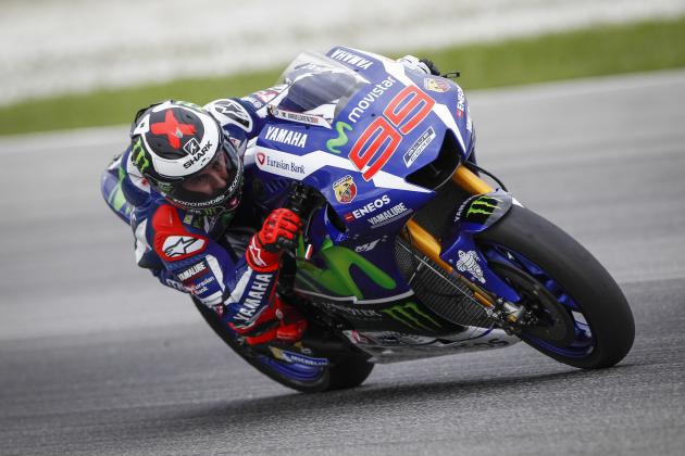MotoGP rider Jorge Lorenzo of Spain steers his Yamaha out of a corner during a pre-season test at Sepang International Circuit in Sepang, Malaysia, Wednesday, Feb. 3,  2016. (AP Photo/Joshua Paul)