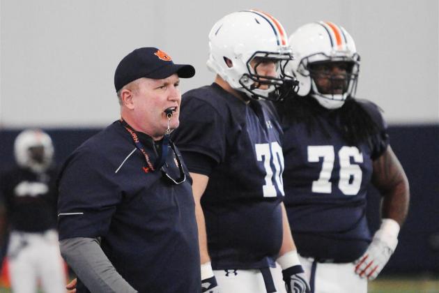 Auburn OL coach Herb Hand (left)