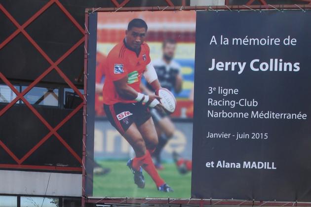 A French RCN (racing club de Narbonne) supporter stands in front of a picture of All Black's Jerry Collins on June 7, 2015 in Narbonne, southwestern France as some 1,500 people take part in a silent march for the late New Zealander player who tragically died in a car crash on June 5 in nearby Beziers. Collins, 34, who was playing for Narbonne, and his partner Alana Madill died instantly in the crash, and their baby daughter Ayla is in a critical condition in hospital. AFP PHOTO / RAYMOND ROIG        (Photo credit should read RAYMOND ROIG/AFP/Getty Images)