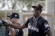 Miami Marlins hitting coach Barry Bonds watches spring training baseball batting practice Monday, Feb. 22, 2016, in Jupiter, Fla. (AP Photo/Jeff Roberson)
