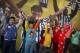 Chinese children dance along with a video demonstrating the various signals used by football referees at a National Football League publicity event held in Beijing, Sunday, Nov. 8, 2015. The NFL has been aggressively promoting football in China hoping to take advantage of rising income and growing taste for exotic foreign sports. (AP Photo/Mark Schiefelbein)