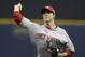 Cincinnati Reds starting pitcher Homer Bailey throws to the Milwaukee Brewers during the first inning of a baseball game Thursday, April 23, 2015, in Milwaukee. (AP Photo/Jeffrey Phelps)