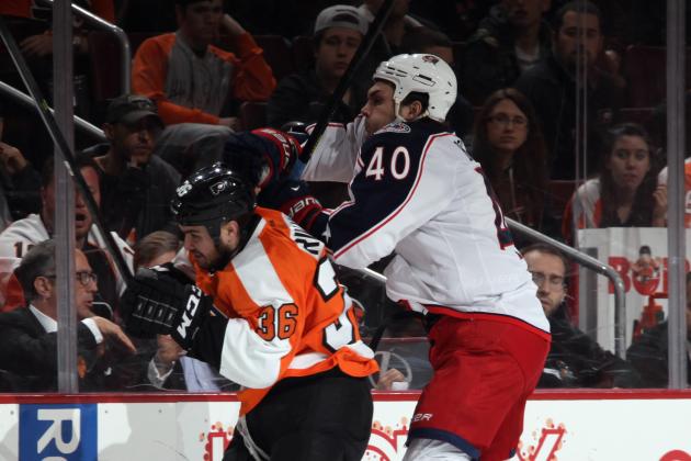 PHILADELPHIA, PA - APRIL 03: Jared Boll #40 of the Columbus Blue Jackets hits Zac Rinaldo #36 of the Philadelphia Flyers during the third period at the Wells Fargo Center on April 3, 2014 in Philadelphia, Pennsylvania. The Blue Jackets shut out the Flyers 2-0. (Photo by Bruce Bennett/Getty Images)