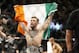 Conor McGregor reacts after defeating Jose Aldo during a featherweight championship mixed martial arts bout at UFC 194, Saturday, Dec. 12, 2015, in Las Vegas. (AP Photo/John Locher)
