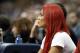 WWE star Eva Marie watches the New Orleans Pelicans and the Dallas Mavericks play in the second half of an NBA basketball game Saturday, Nov. 7, 2015, in Dallas. The Mavericks won 107-98. (AP Photo/Tony Gutierrez)